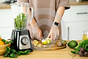 Woman cooking breakfast from fresh smoothie at the kitchen. Healthy llifestyle concept