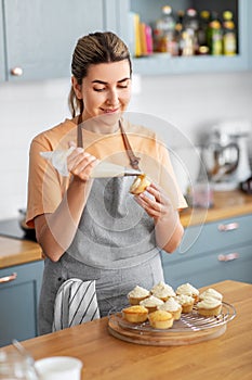 woman cooking food and baking on kitchen at home