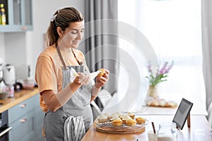 woman cooking food and baking on kitchen at home