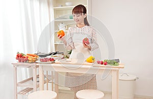 Woman cooking in kitchen