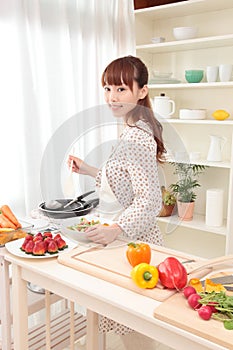 Woman cooking in kitchen