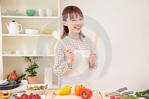 Woman cooking in kitchen