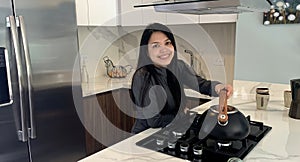 Woman cooking in kitchen making healthy food