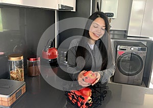 Woman cooking in kitchen making healthy food