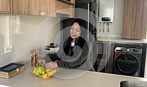 Woman cooking in kitchen making healthy food