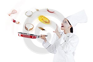 Woman cooking with magic in studio