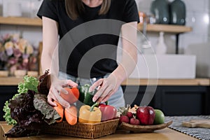 Woman cooking in new kitchen making healthy food with vegetables