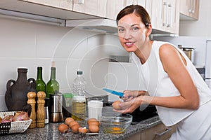 woman cooking omelet