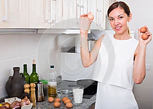 Woman cooking omelet