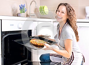 Woman Cooking Pizza photo