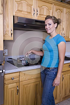 Woman cooking on stove