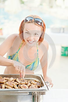 Woman cooks food