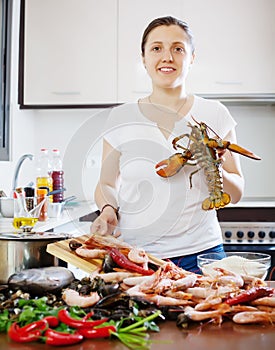 Woman cooks seafood