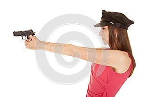 Woman cop pink dress gun face side point