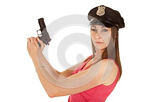 Woman cop pink dress gun side look
