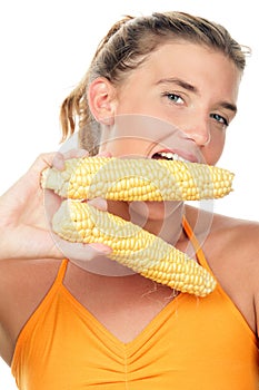 Woman with corn cobs photo