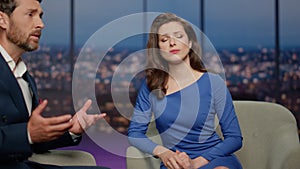 Woman correspondent listening man in tv program. Closeup guest complaining show