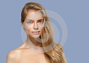 Woman cosmetic closeup beauty portrait. Over blue color background