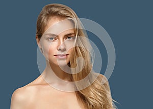 Woman cosmetic closeup beauty portrait. Over blue color background
