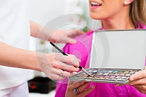 Woman in cosmetic salon with makeup