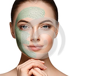 Woman with cosmetic scrab mask on face. photo