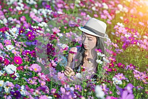 Woman and cosmos flowers.