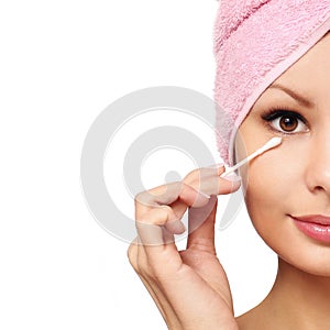 Woman with cotton swab. Skincare