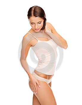 Woman in cotton underwear showing slimming concept