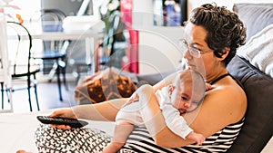 Woman on the couch with her baby