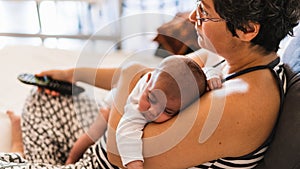 Woman on the couch with her baby