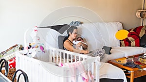Woman on the couch with her baby