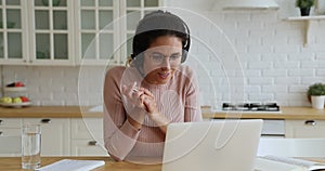 Woman counsellor in headset use laptop provide assistance by videocall