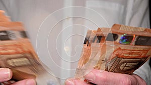 woman counting fifty euro banknotes