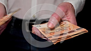 woman counting fifty euro banknotes