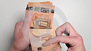 Woman counting fifty euro banknotes