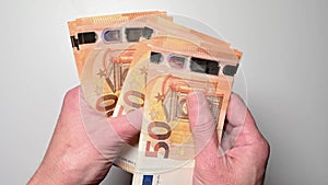 woman counting fifty euro banknotes