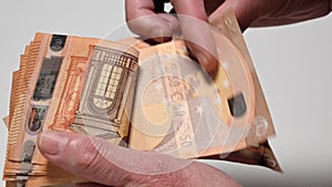 woman counting fifty euro banknotes