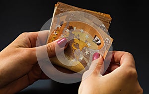 Woman counting money, counting EURO close up