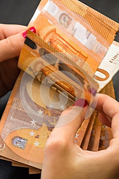 Woman counting money, counting EURO close up