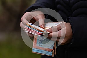 Woman counting money, counting EURO close up