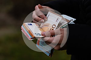 Woman counting money, counting EURO close up