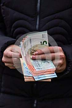 Woman counting money, counting EURO close up