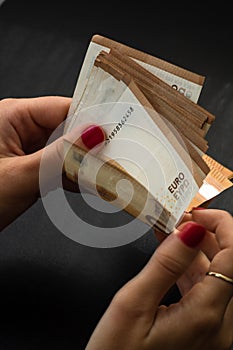 Woman counting money, counting EURO close up