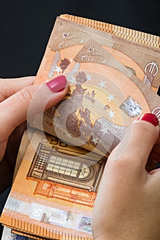 Woman counting money, counting EURO close up