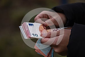 Woman counting money, counting EURO close up