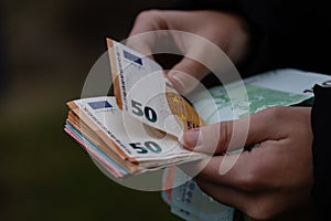 Woman counting money, counting EURO close up