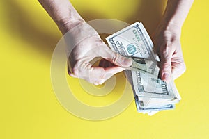 Woman counting money, economy concept, allocation of money