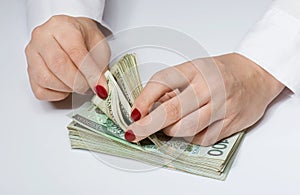 Woman counting money by hands