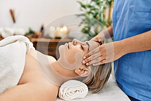 Woman couple having facial massage at beauty center photo