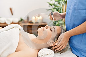 Woman couple having facial treatment at beauty center photo